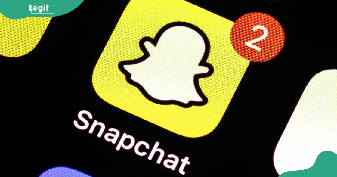 The Snapchat app icon can be seen on the display of a smartphone.