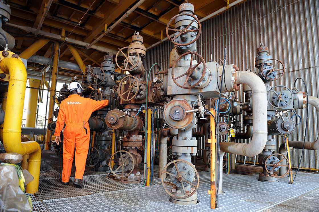 A worker inspects facilities at Amenem A worker inspects facilities at Amenem