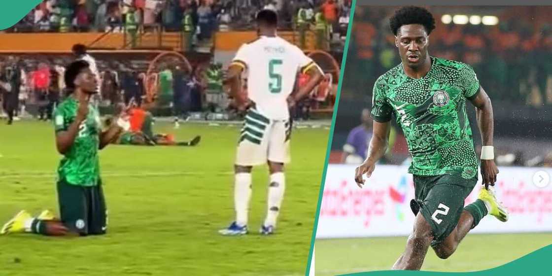 Ola Aina prays in front Cameroon player Ola Aina prays in front Cameroon player