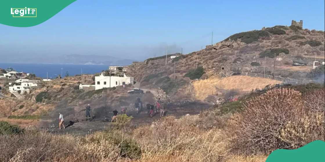 The wreckage of a private helicopter lies near its intended landing pad on Sifnos.