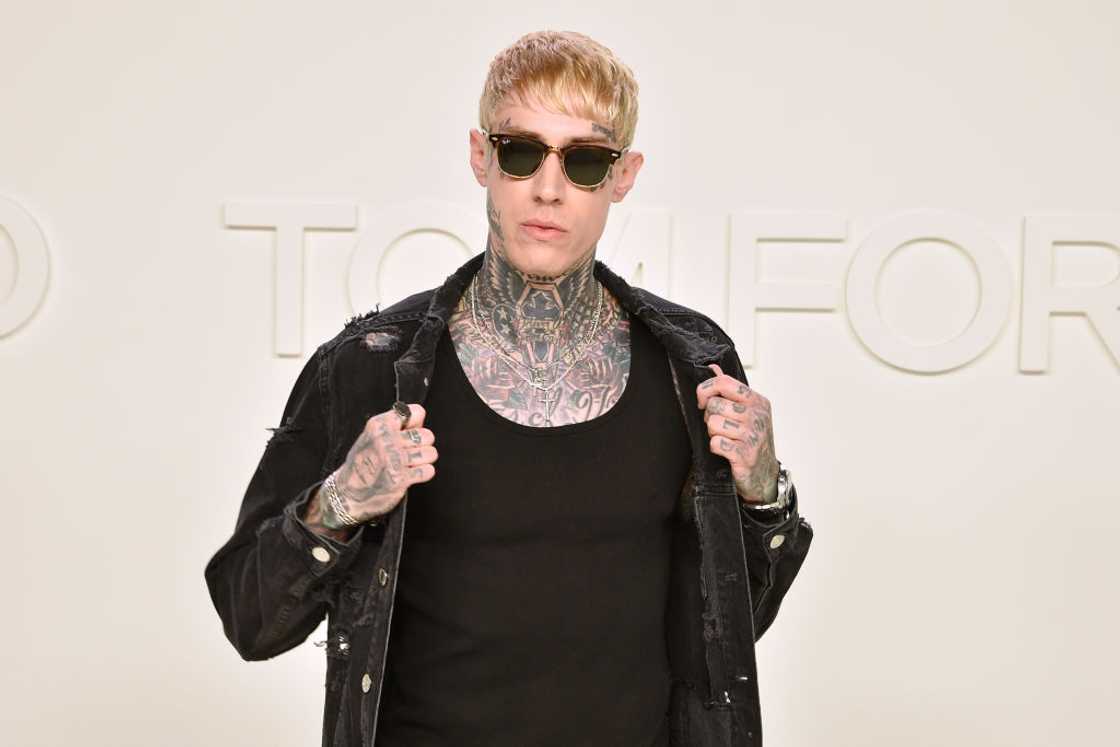 Trace Cyrus posing in all black at the Tom Ford AW/20 Fashion Show