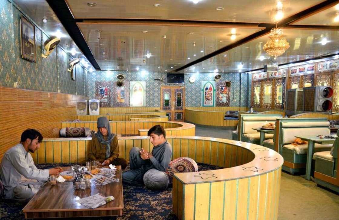 Afghan men have breakfast in a restaurant in Kandahar, home to the power base of Taliban leader Hibatullah Akhundzada Afghan men have breakfast in a restaurant in Kandahar, home to the power base of Taliban leader Hibatullah Akhundzada