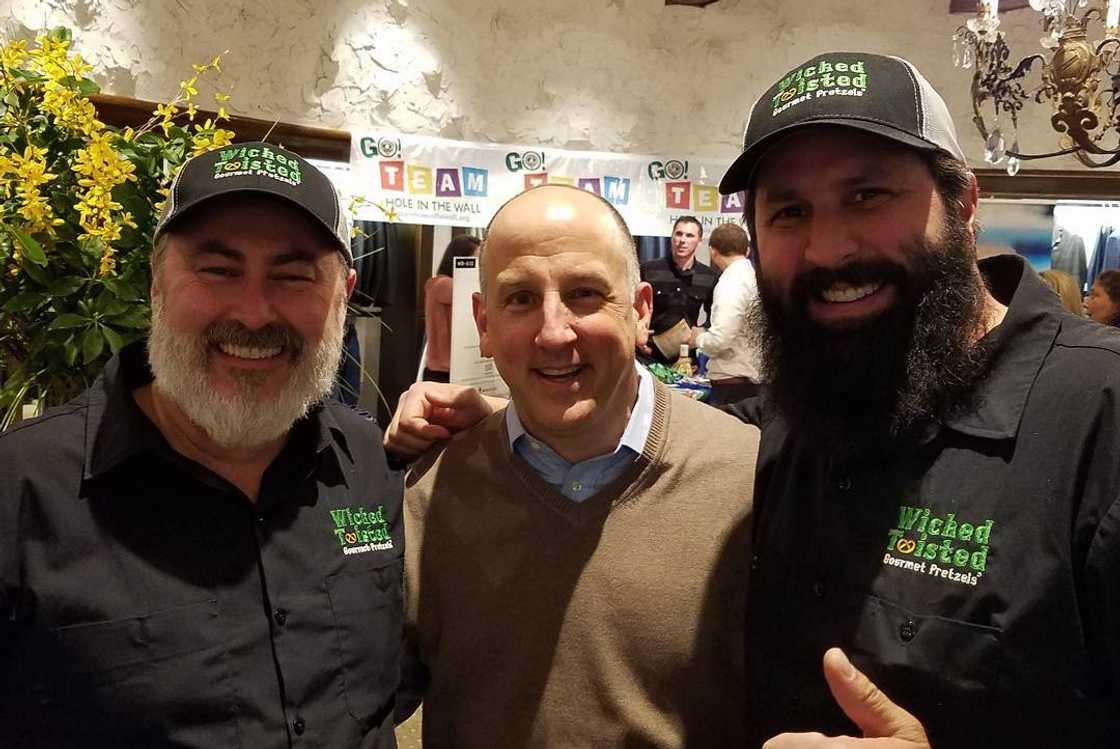 Tony Massarotti (C) alongside friends pose for a photo at Wicked Twisted Pretzels