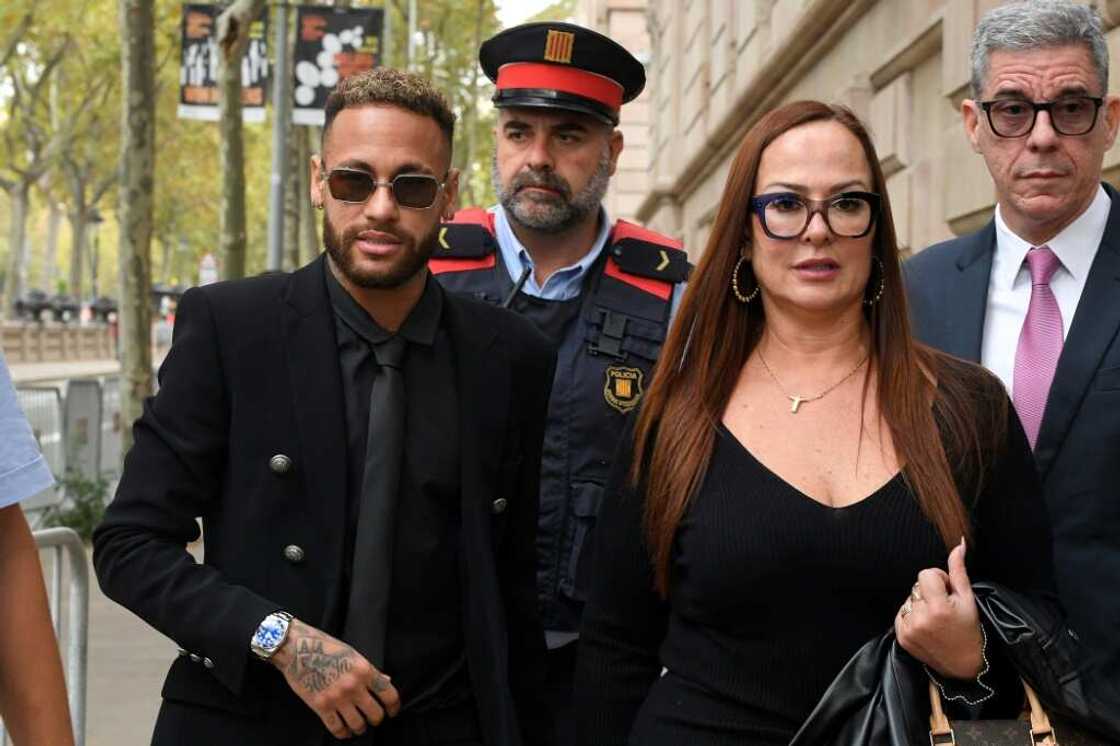 Brazilian superstar Neymar (L, with his mother Nadine Goncalves da Silva Santos) is expected to testify Tuesday at his trial in Barcelona