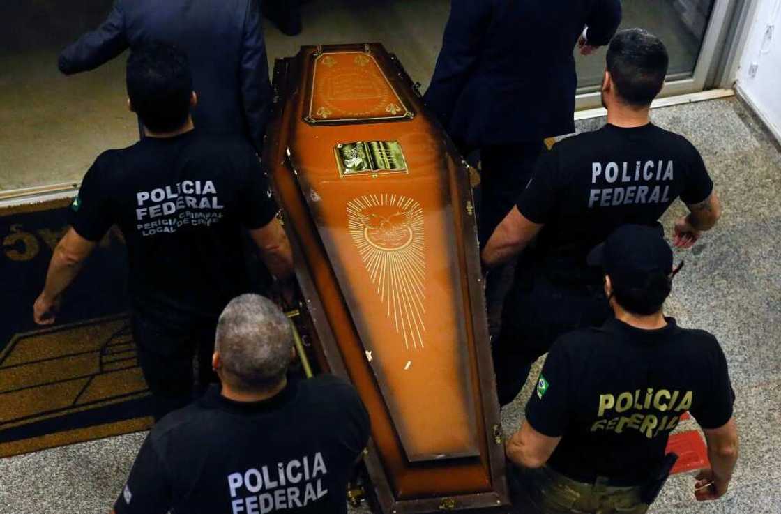 One of the coffins containing human remains found during the search for British journalist Dom Phillips and indigenous expert Bruno Pereira is carried upon arrival at the Federal Police hangar in Brasilia on June 16, 2022 One of the coffins containing human remains found during the search for British journalist Dom Phillips and indigenous expert Bruno Pereira is carried upon arrival at the Federal Police hangar in Brasilia on June 16, 2022