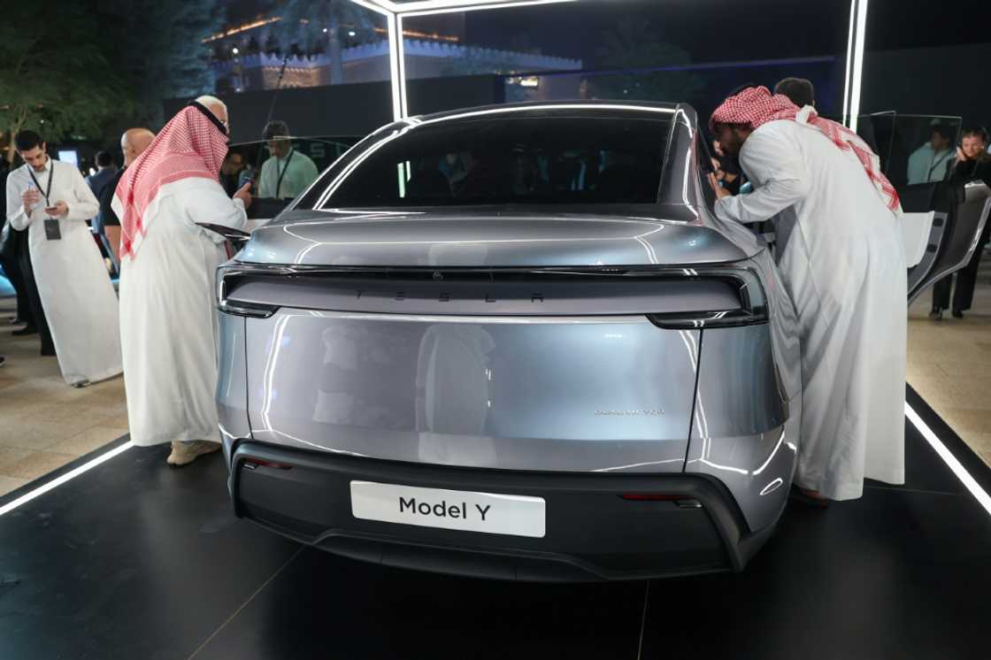 Saudis check a car at the Tesla company's first showroom in Riyadh. Elon Musk's firm has opened three showrooms in oil rich Saudi Arabia Saudis check a car at the Tesla company's first showroom in Riyadh. Elon Musk's firm has opened three showrooms in oil rich Saudi Arabia