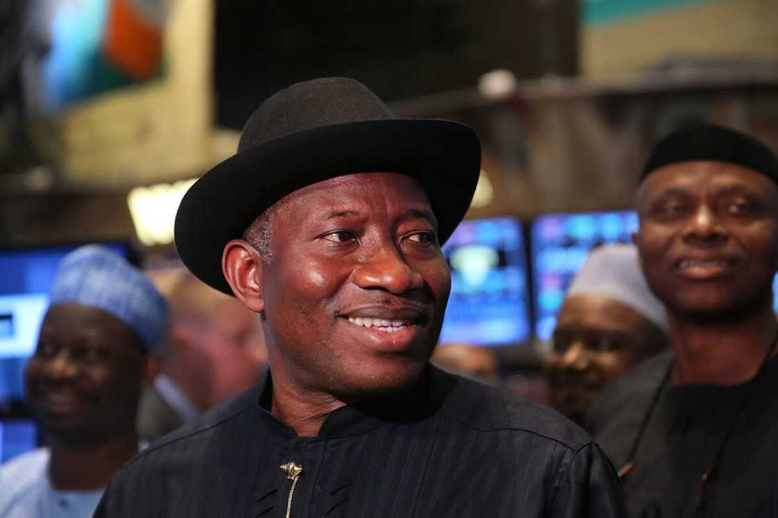 Goodluck Jonathan walks on the floor of the New York Stock Exchange