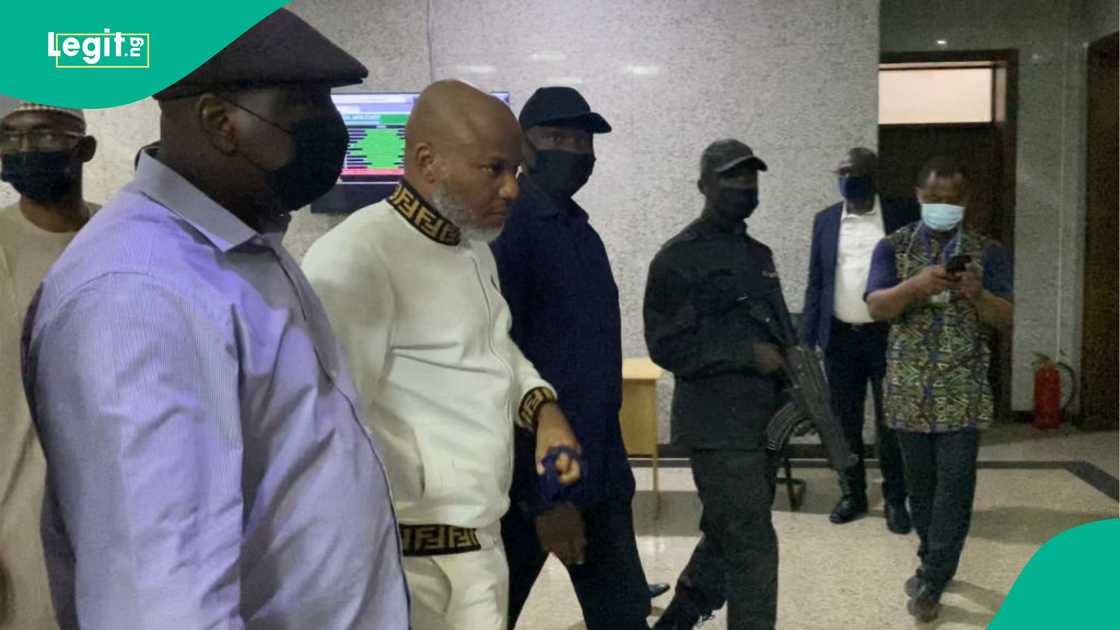 Men of the Nigeria State Secret Police (SSS) escorts Indigenous People of Biafra (IPOB), Nnamdi Kanu (2nd L), outside the Federal High Court during the trial of the IPOB leader