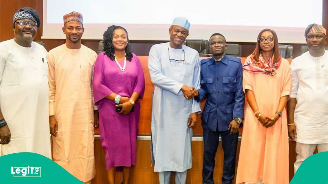 Group photo of NELFUND staff and LAUTECH top graduate at Abuja event Group photo of NELFUND staff and LAUTECH top graduate at Abuja event