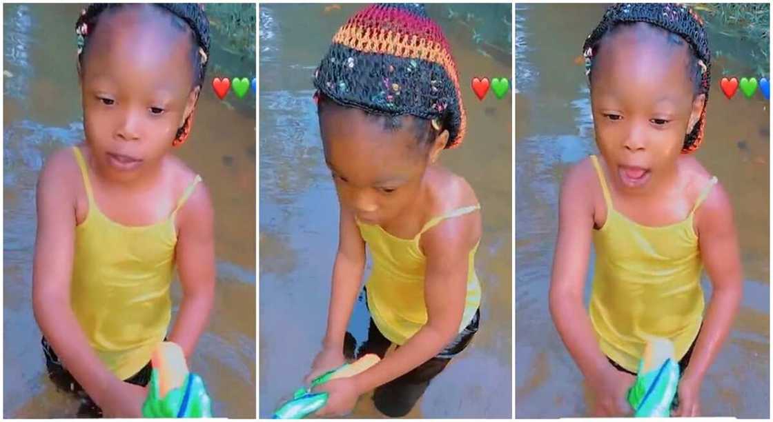 Photos of a Nigerian girl swimming in village river.