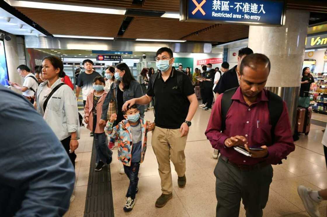 Arrivals from mainland China enter Hong Kong via the Lo Wu border control point on Wednesday