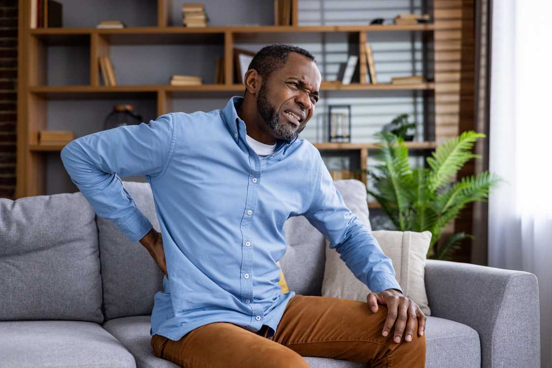 A man with back pains A man with back pains