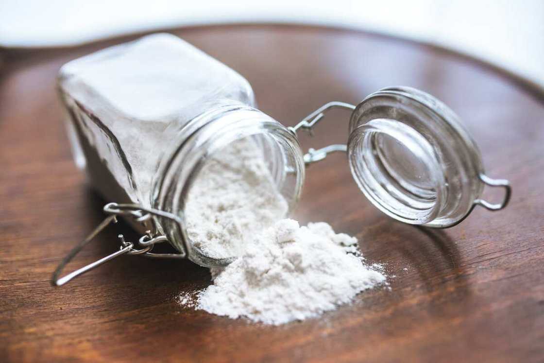 A clear container with baking soda A clear container with baking soda