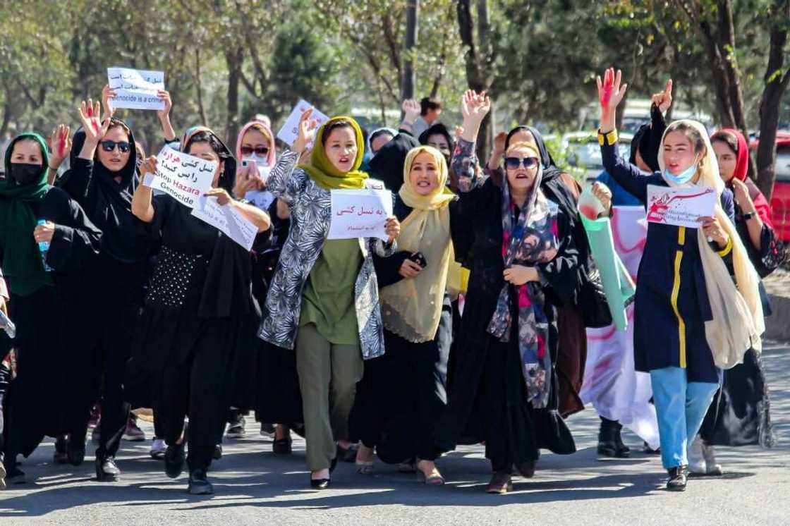 Women from Afghanistan's minority Hazara community protested in Kabul, after a suicide bombing at an education centre left dozens dead