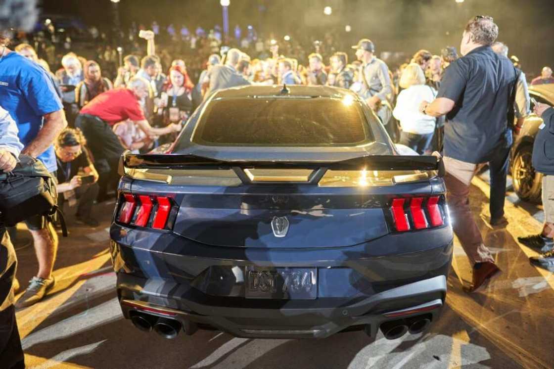 Crowds surround the new Ford Mustang Dark Horse following its debut at the North American International Auto Show in Detroit, Michigan on September 14, 2022 Crowds surround the new Ford Mustang Dark Horse following its debut at the North American International Auto Show in Detroit, Michigan on September 14, 2022