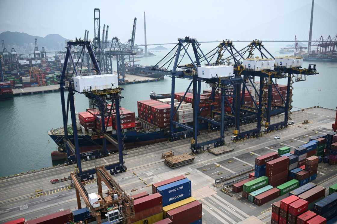 A container ship unloads its cargo at Kwai Chung Container terminal in Hong Kong A container ship unloads its cargo at Kwai Chung Container terminal in Hong Kong