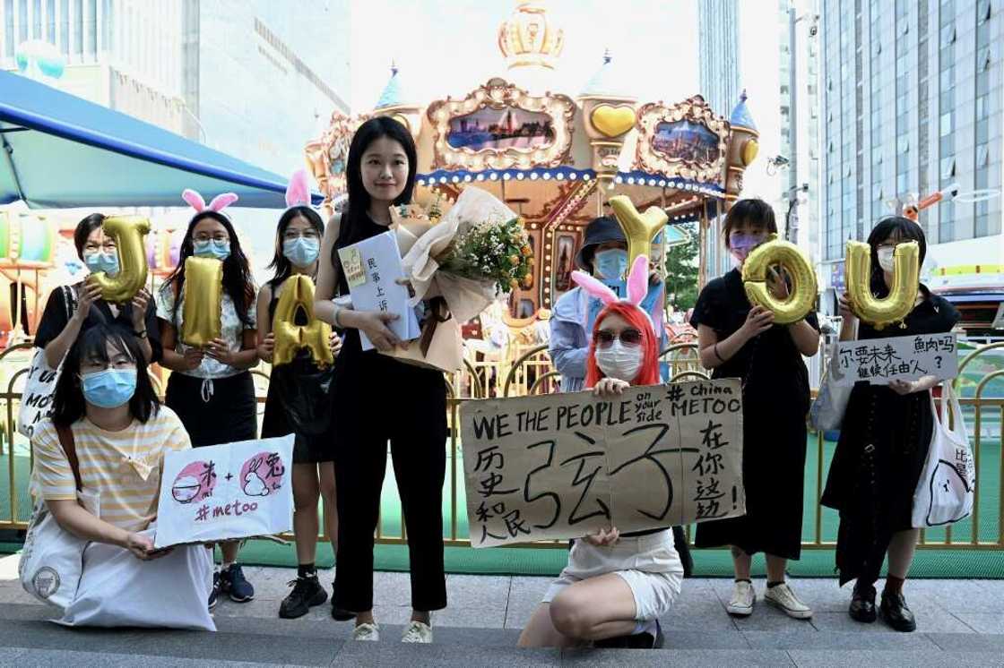 A small group of supporters wished Zhou Xiaoxuan (C) well ahead of her appeal hearing in Beijing A small group of supporters wished Zhou Xiaoxuan (C) well ahead of her appeal hearing in Beijing