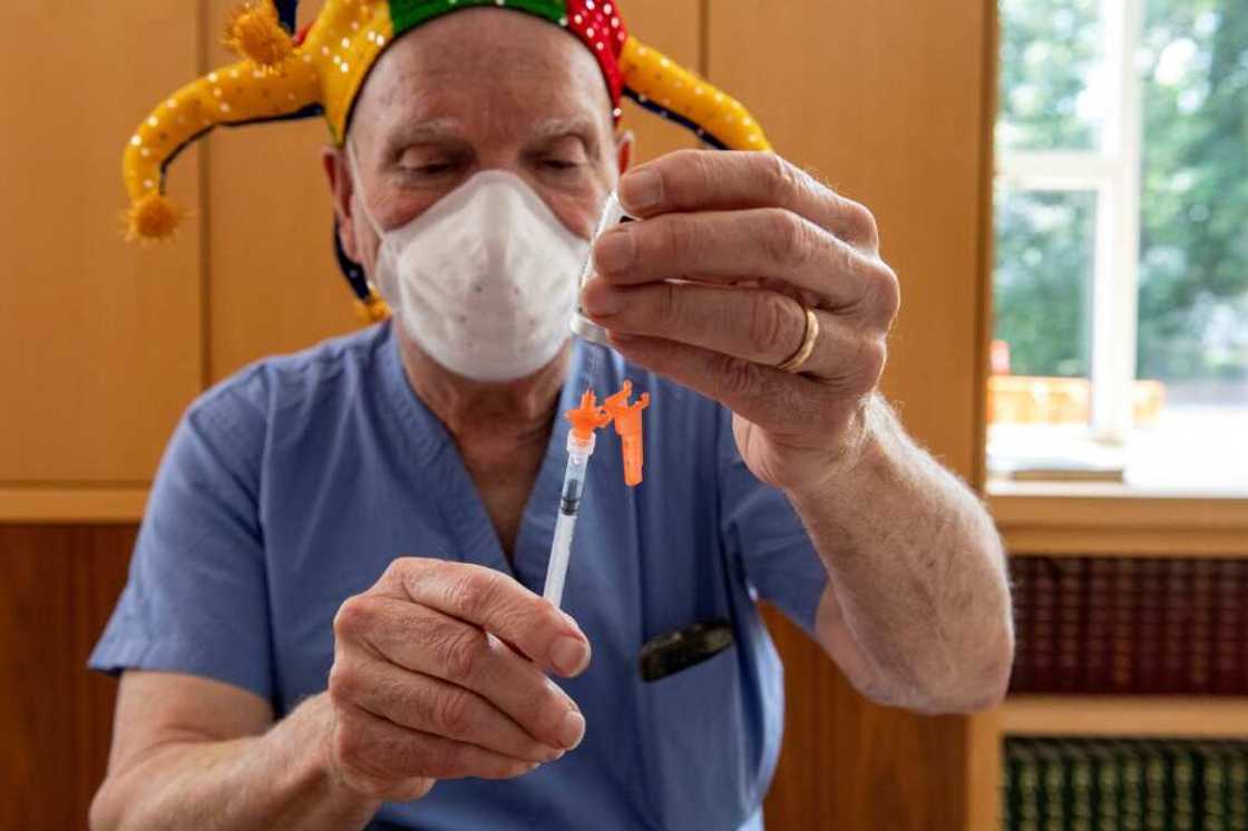 A medical workers draws the new Moderna Covid-19 Child Vaccine from a vial at Temple Beth Shalom in Needham, Massachusetts