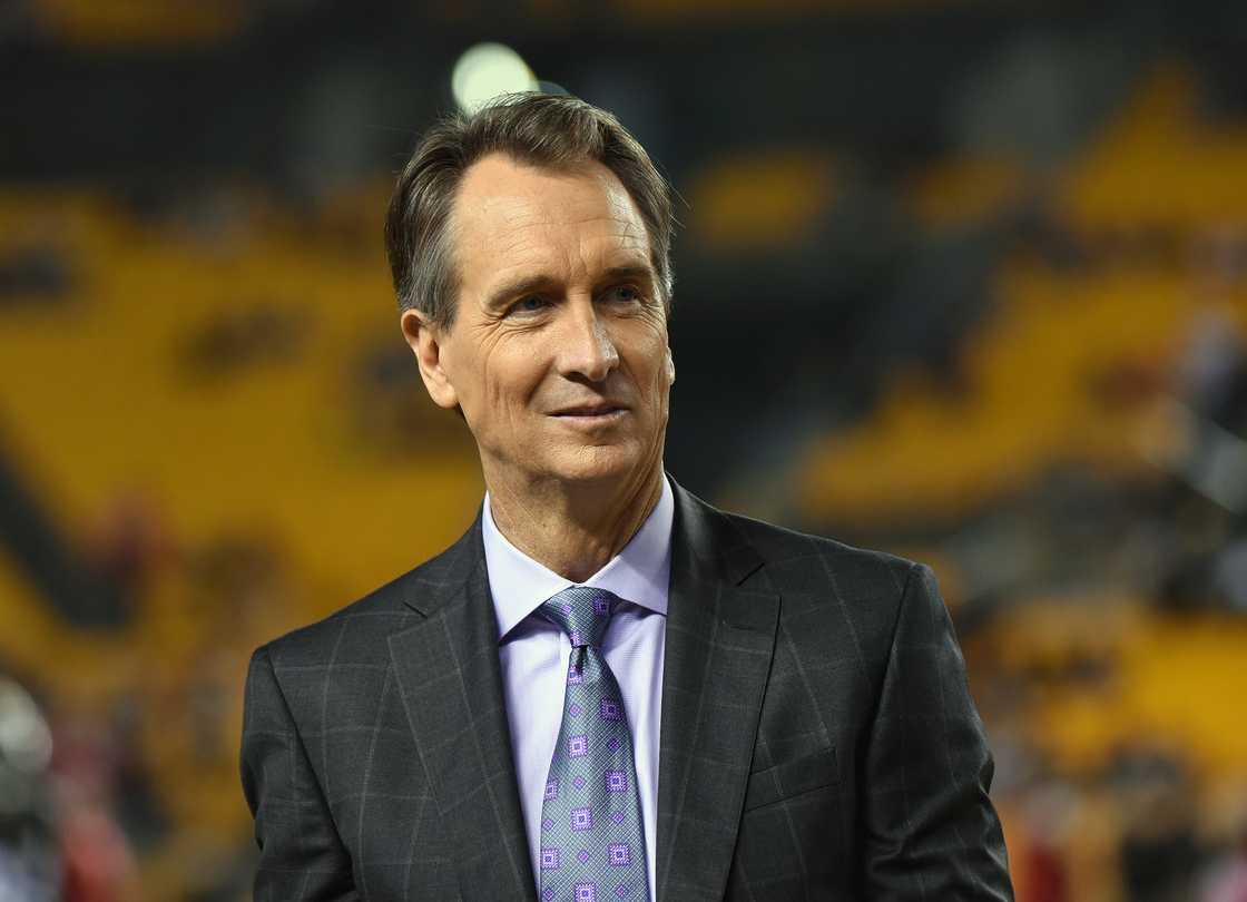 Cris Collinsworth, NBC Sports Sunday Night Football announcer, looks on from the sideline before a game between the Kansas City Chiefs and Pittsburgh Steelers at Heinz Field