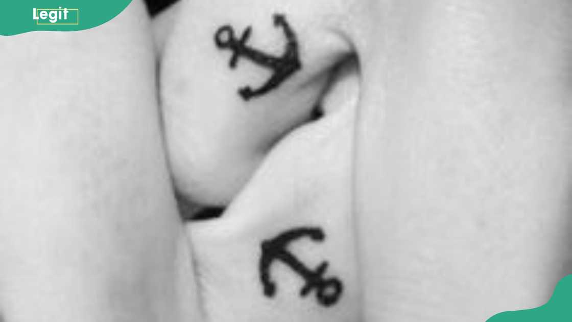 Anchor wedding ring tattoo