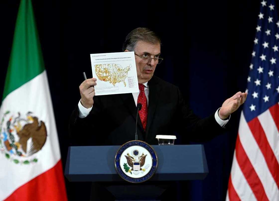 Mexican Foreign Secretary Marcelo Ebrard, speaking at a press conference at the US State Department, holds a map of American counties that sell the most number of weapons that end up seized in Mexico Mexican Foreign Secretary Marcelo Ebrard, speaking at a press conference at the US State Department, holds a map of American counties that sell the most number of weapons that end up seized in Mexico