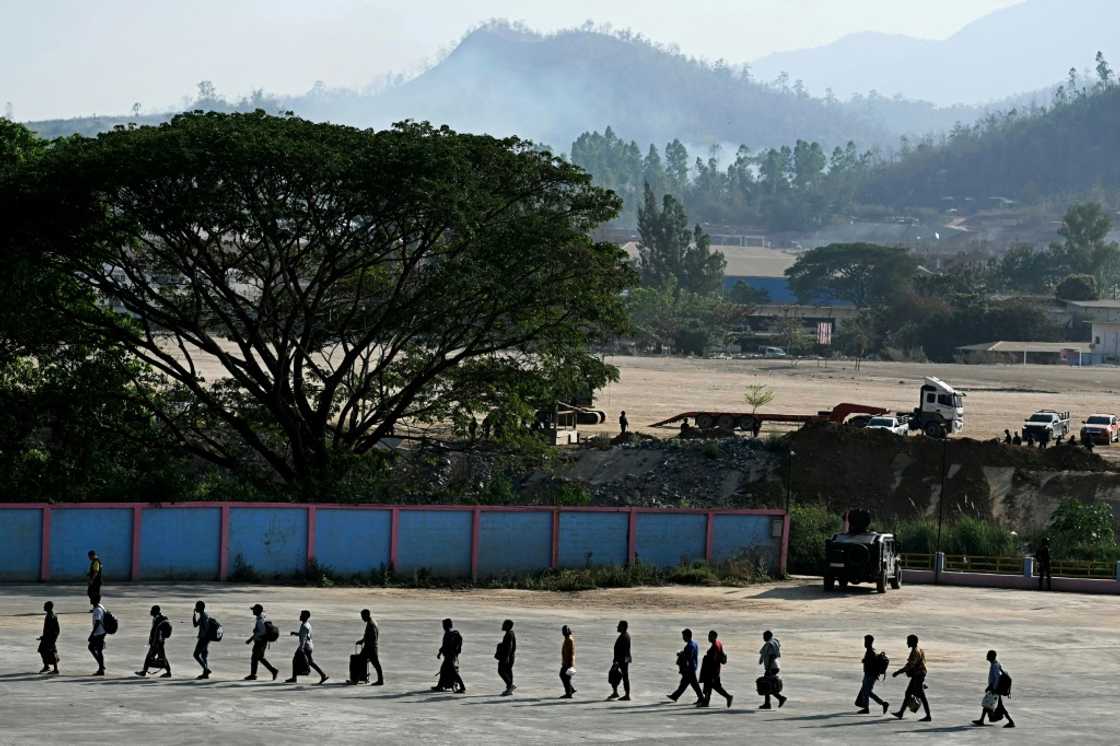 Scam centre workers are taken across the Thai border after being released in February Scam centre workers are taken across the Thai border after being released in February
