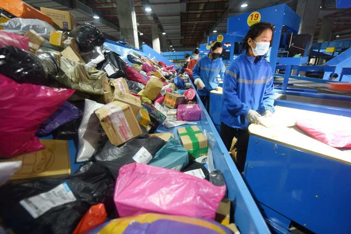 An employee sorts packages for delivery during the Singles Day shopping festival at a logistics center in Donghai, China An employee sorts packages for delivery during the Singles Day shopping festival at a logistics center in Donghai, China