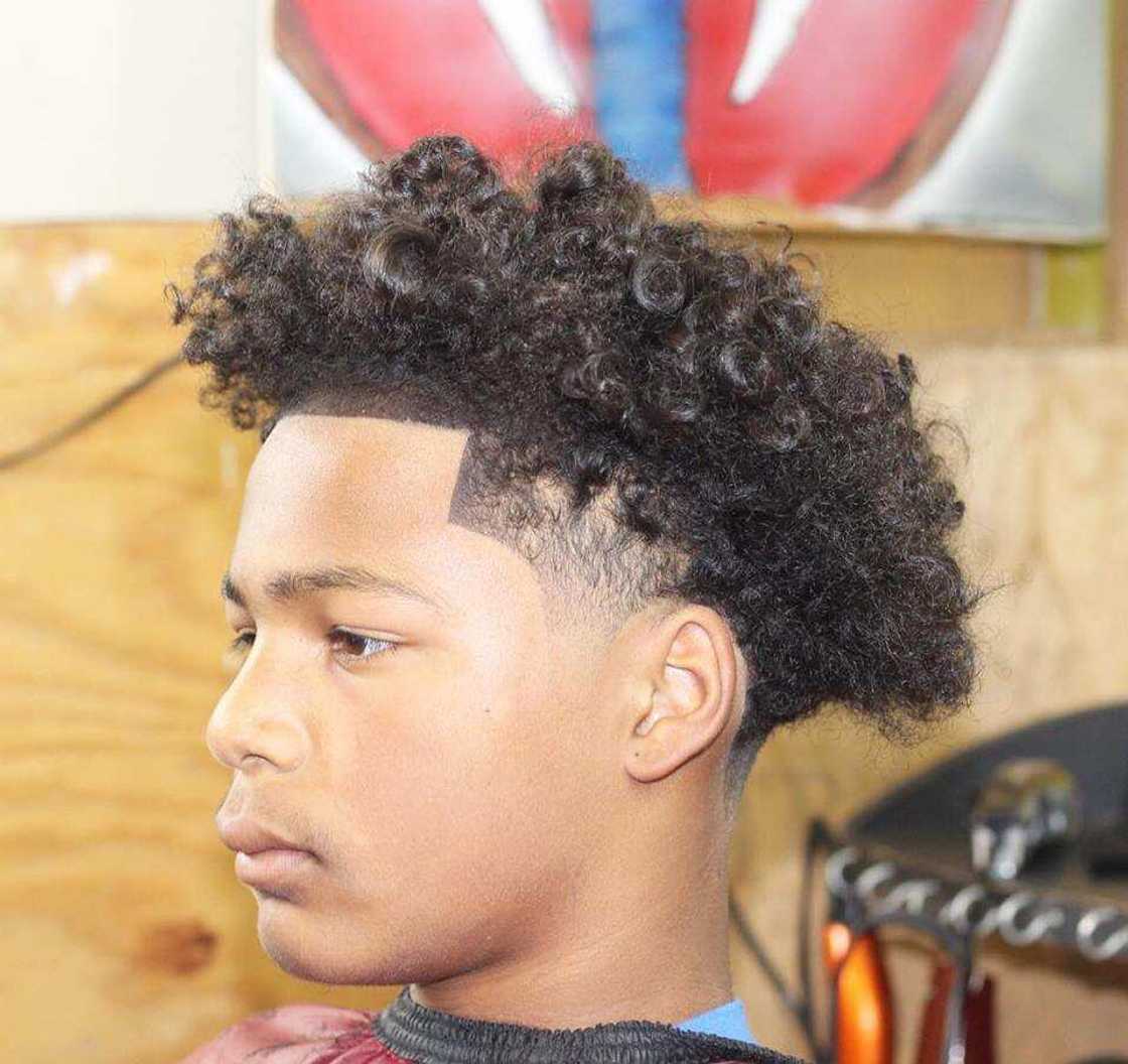 Low fade cut with curls Low fade cut with curls