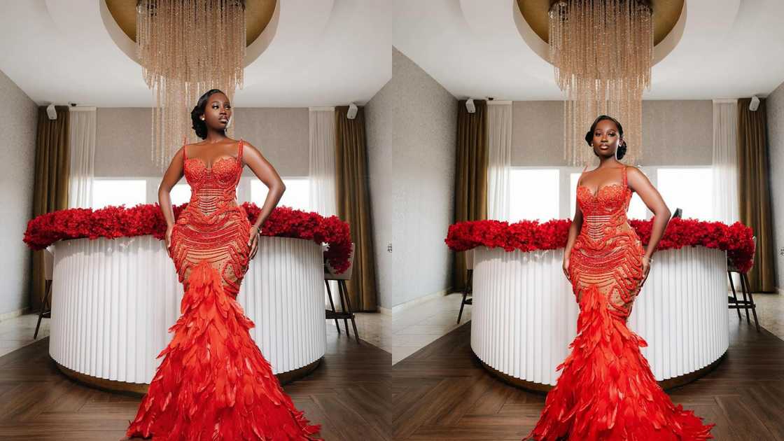 A red mermaid gown with a feathery mermaid tail