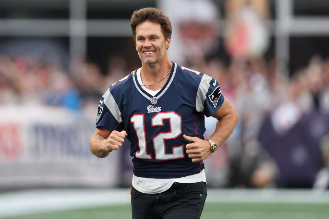 Tom Brady jogs onto the field wearing his number 12 jersey Tom Brady jogs onto the field wearing his number 12 jersey