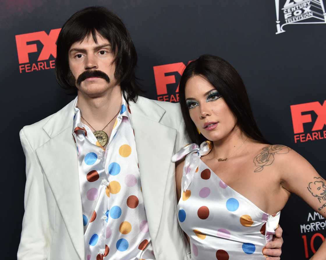 Evan Peters (L) and Halsey at a Red Carpet event posing for a photo