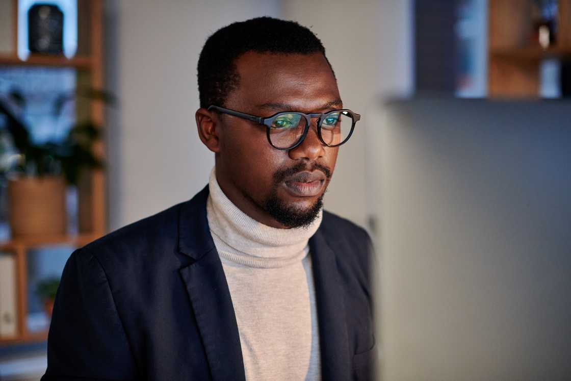 A man looks at the screen