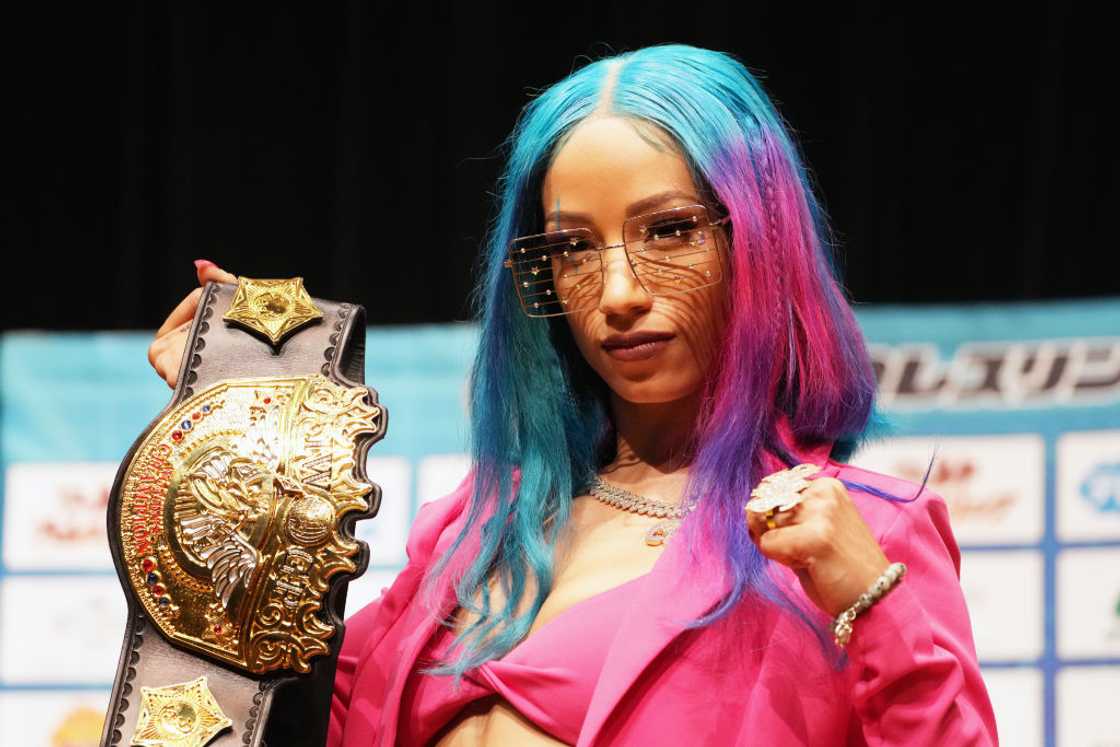 Mercedes Mone (Sasha Banks) poses with a belt at the New Japan Pro-Wrestling Press Conference