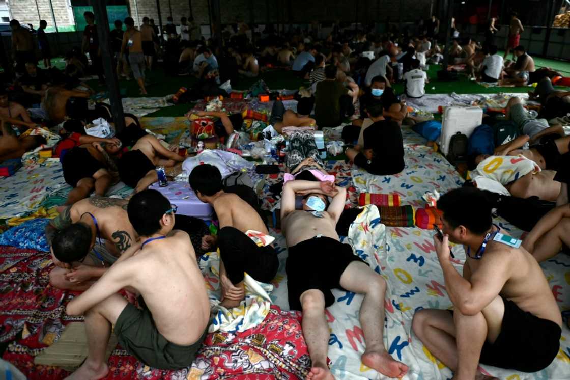 Released scam centre workers wait to be brought into Thailand during the crackdown in February Released scam centre workers wait to be brought into Thailand during the crackdown in February
