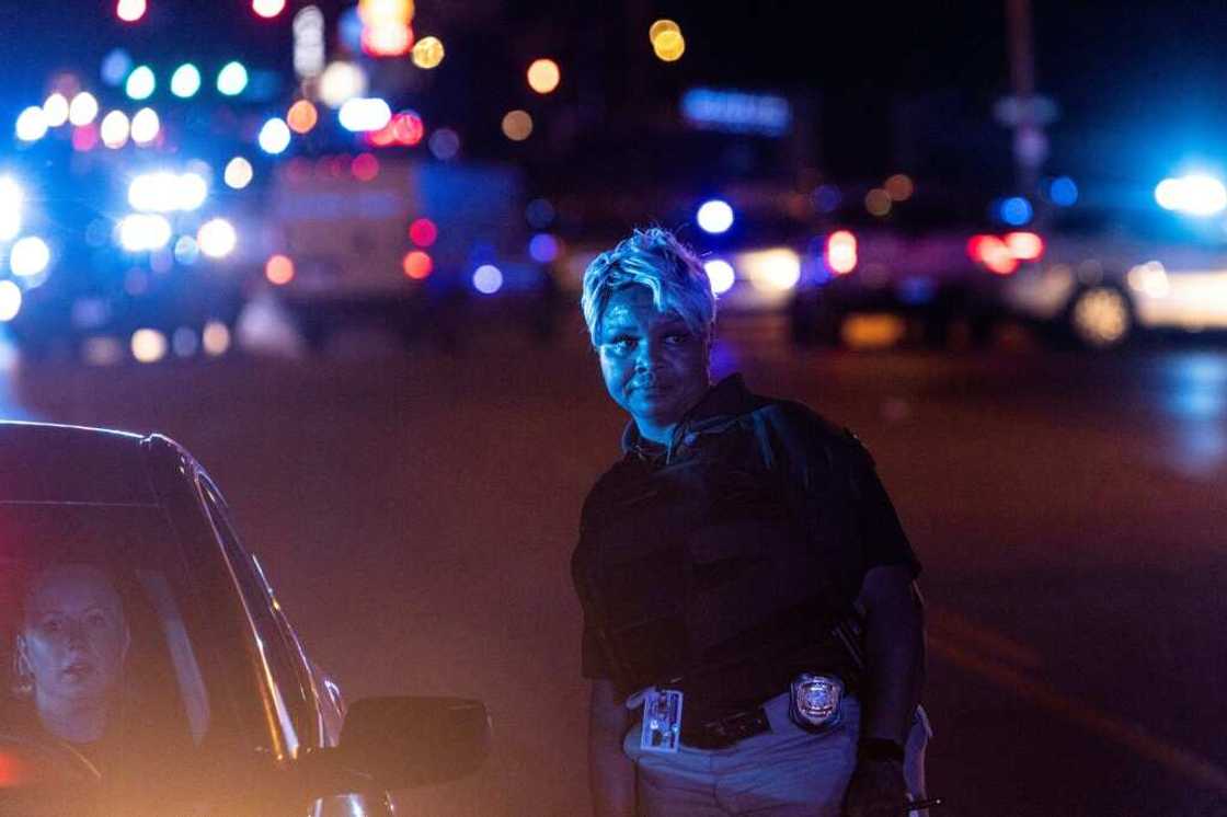 Police investigate the scene of a carjacking related to the Memphis shooting spree Police investigate the scene of a carjacking related to the Memphis shooting spree