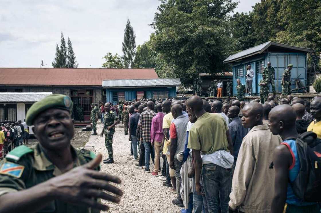 Hundreds of volunteers line up near a military base in Goma for army training Hundreds of volunteers line up near a military base in Goma for army training