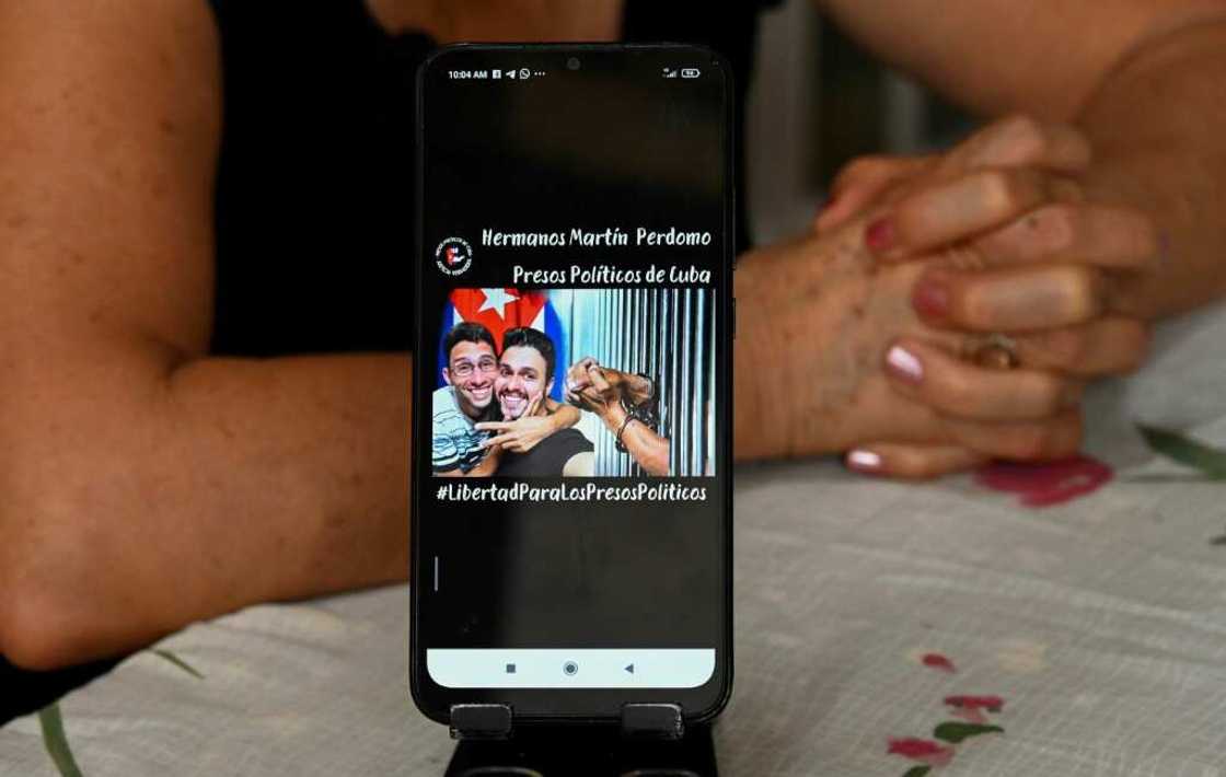 Marta Perdomo, mother of brothers Nadir Martin and Jorge Martin Perdomo -- who were detained in July 11, 2021 protests against the government in Cuba -- shows a picture of her sons Marta Perdomo, mother of brothers Nadir Martin and Jorge Martin Perdomo -- who were detained in July 11, 2021 protests against the government in Cuba -- shows a picture of her sons
