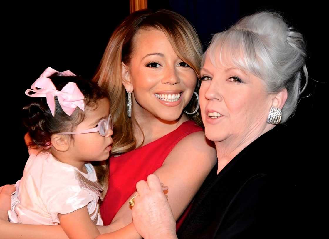 Mariah Carey holding her daughter, Monroe Cannon, alongside her mother, Patricia Carey. Mariah Carey holding her daughter, Monroe Cannon, alongside her mother, Patricia Carey.