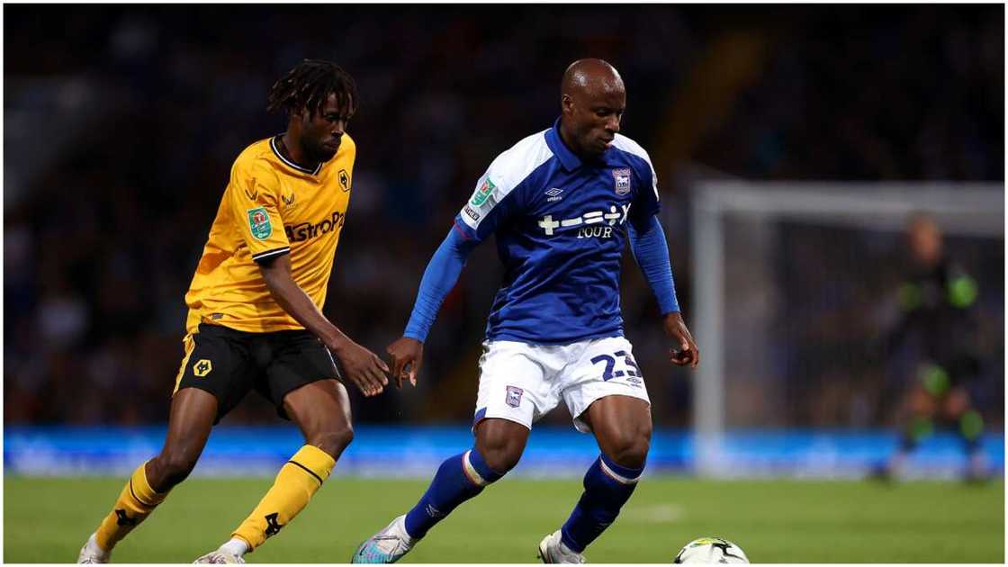 Sone Aluko playing for Ipswich Town against Wolves' Boubacar Traore in the Carabao Cup.