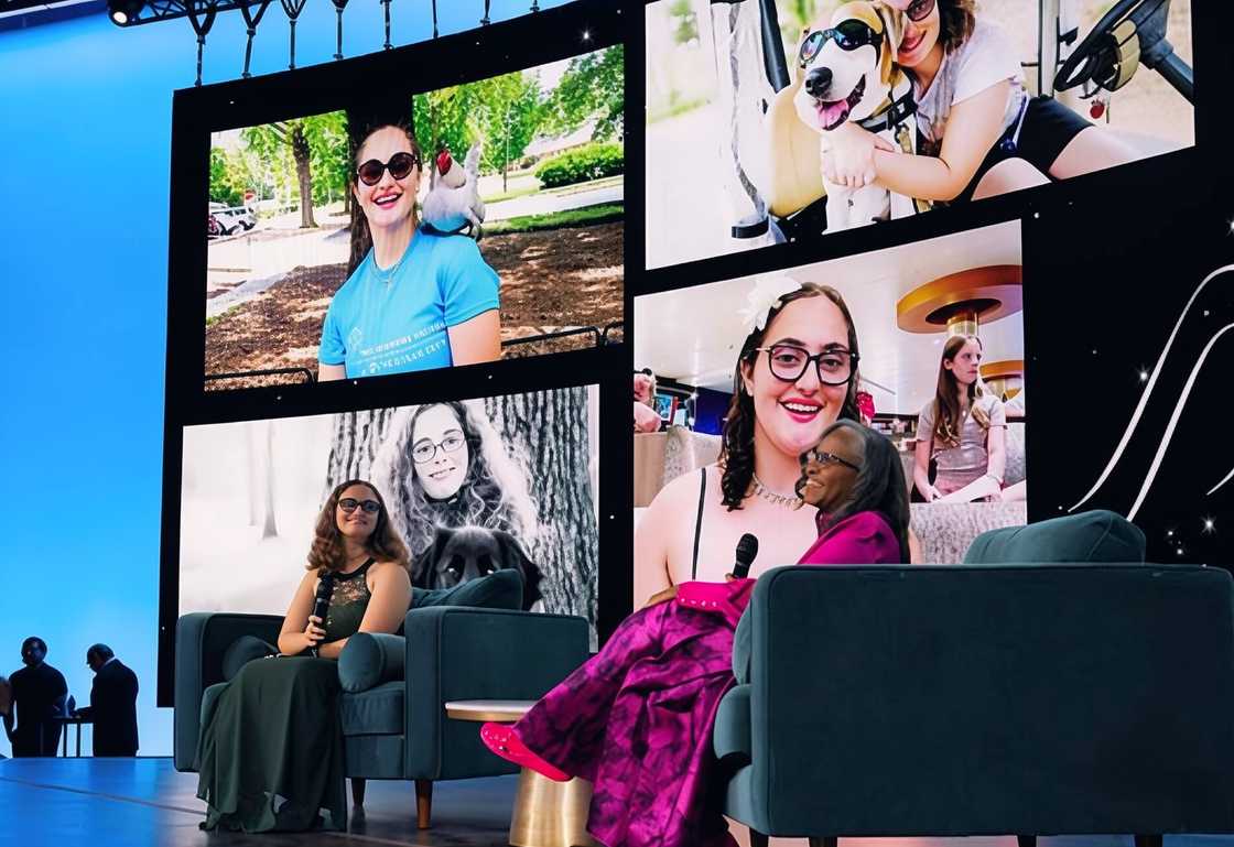 Georgie Harris sits in a panel interview setting