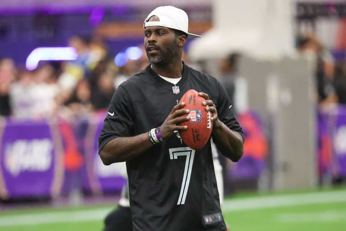 Michael Vick attempts a pass during a celebrity flag football game Michael Vick attempts a pass during a celebrity flag football game