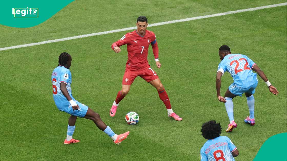 Cristiano Ronaldo under pressure from Ngalayel Mukau and Chancel Mbemba during the FIFA World Cup 2026 match between Portugal and Congo DR. Photo by Lars Baron Cristiano Ronaldo under pressure from Ngalayel Mukau and Chancel Mbemba during the FIFA World Cup 2026 match between Portugal and Congo DR. Photo by Lars Baron
