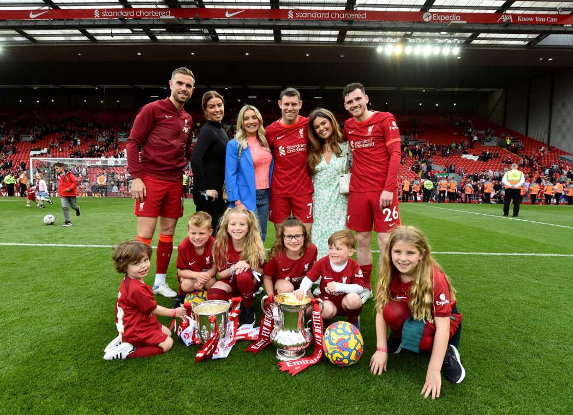 Jordan Henderson, Andrew Robertson and James Milner with their families Jordan Henderson, Andrew Robertson and James Milner with their families