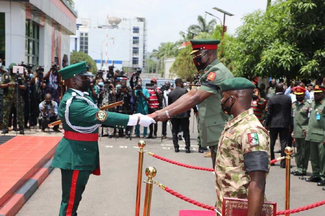 Magor-General Farouk Yahaya receiving his staff of office Magor-General Farouk Yahaya receiving his staff of office
