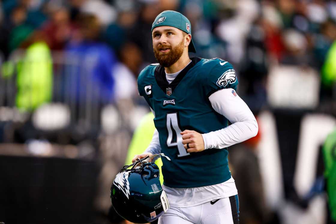 Jake Elliott smiles while running to the locker room during an NFC Championship NFL football game