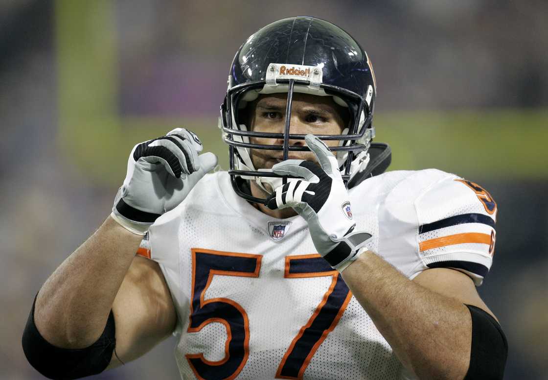 Olin Kreutz signals during a game