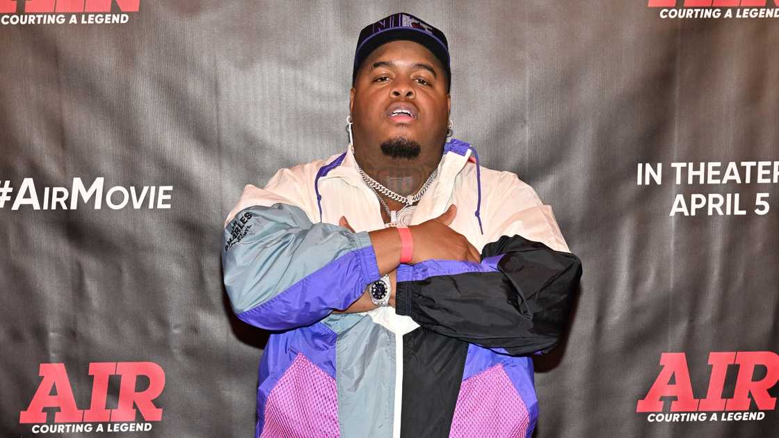 Duke Deuce folds his hands while on the red carpet of the Atlanta Special Advance Screening of AIR