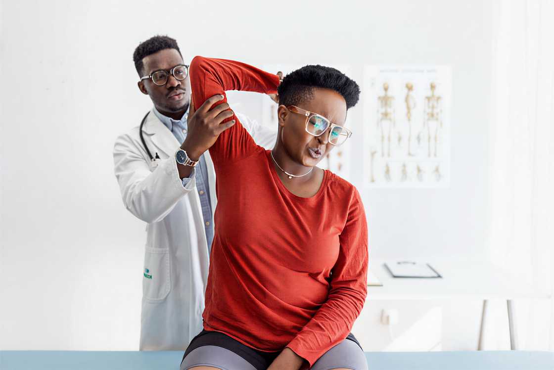 A male physiotherapy worker with a client