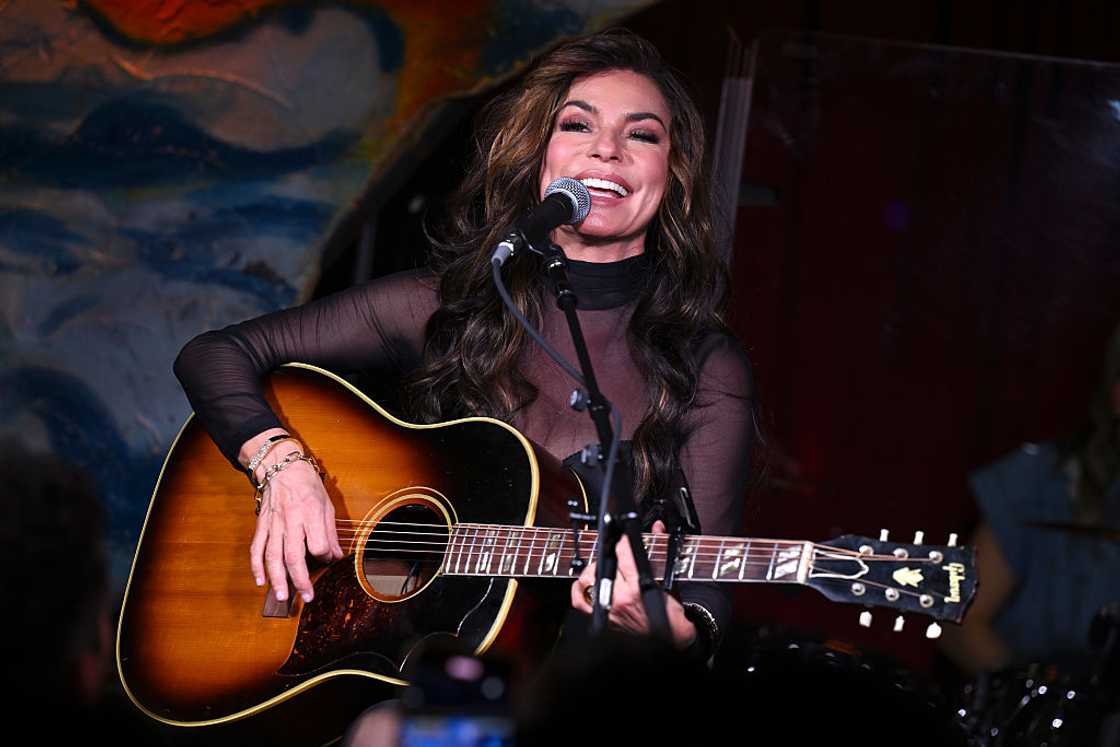 Singer-songwriter performing on stage Singer-songwriter performing on stage