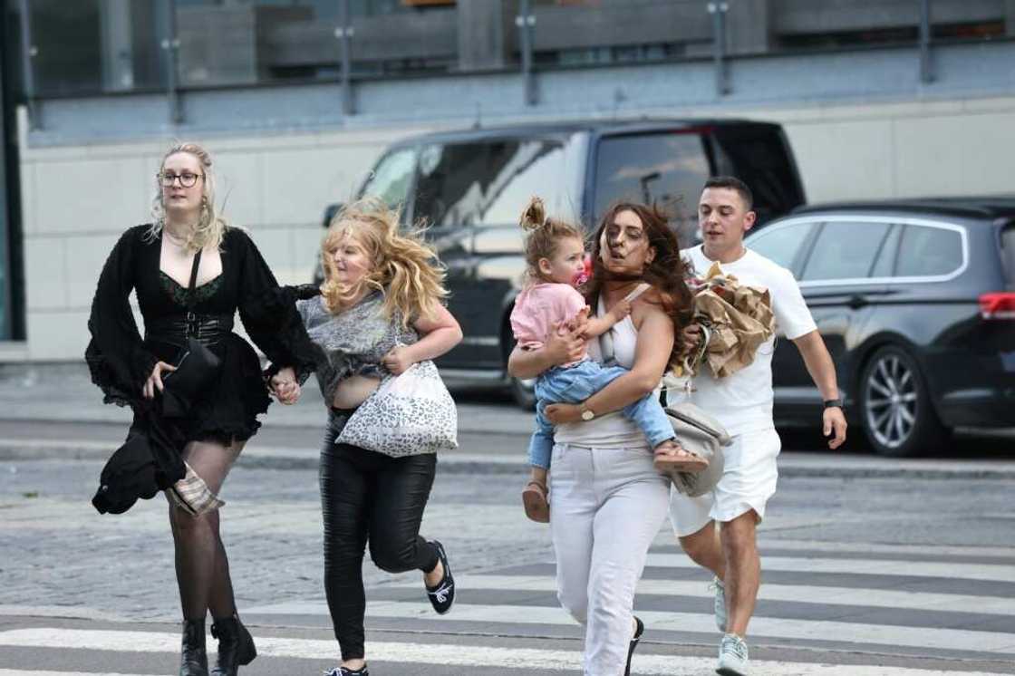 Images from the scene showed parents carrying their children as they fled the building and ambulance personnel carrying people away on stretchers Images from the scene showed parents carrying their children as they fled the building and ambulance personnel carrying people away on stretchers